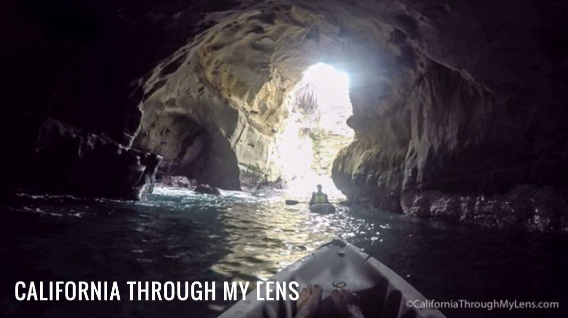 First person point of view photo from inside an ocean sea cave in La Jolla. The photographer is on a kayak