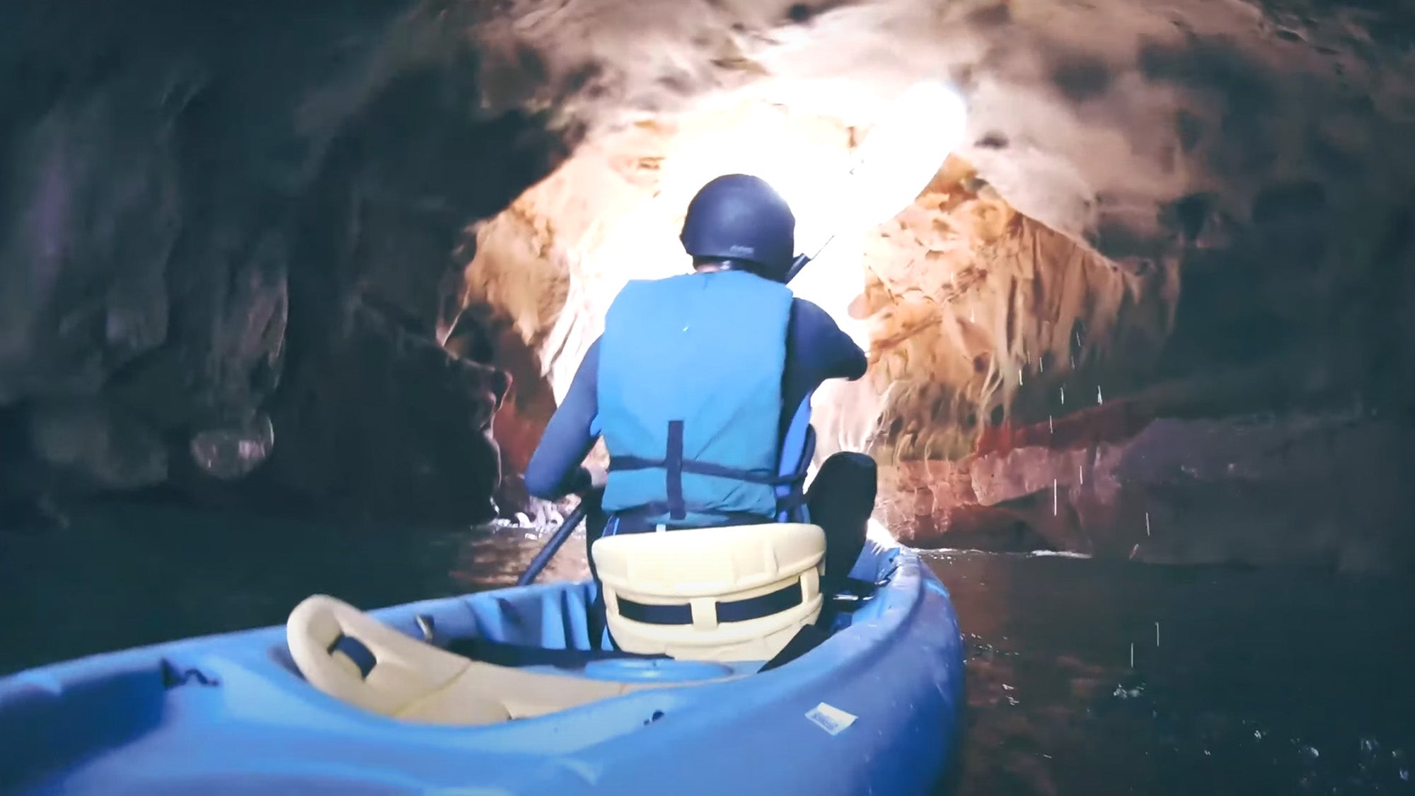 Photo of a kayaker inside a sea cave