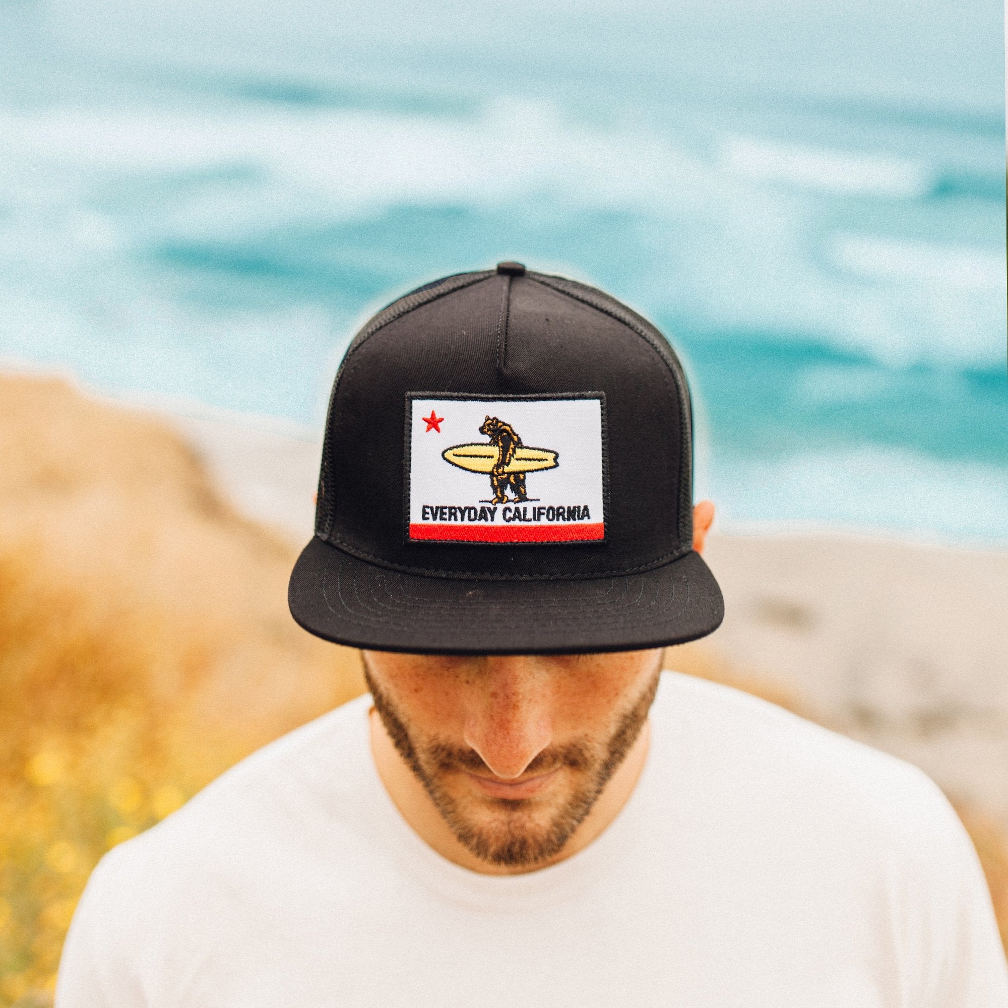 The California flag, reimagined. The Shores is a surfers' classic with our signature flag patch on a baseball cap design. Pure and simple California style.  Details:  Classic Everyday California Flag patch Breathable mesh backing Retro style has a curved brim Classic style has a flat brim  This hat supports ocean conservation & sustainability.  Our Shores Snapback is just the right size for most heads. 