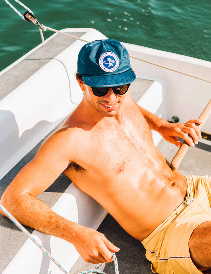 Photo of a man in a Floating Waterproof Snapback in a boat